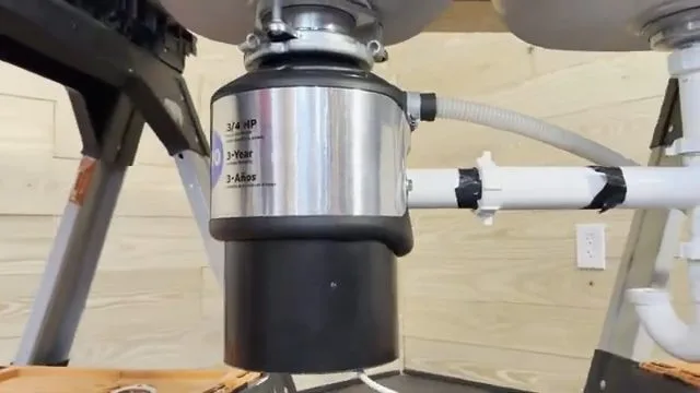 Attaching discharge pipe to garbage disposal, captured on a garbage disposal job near Chino Valley, AZ.