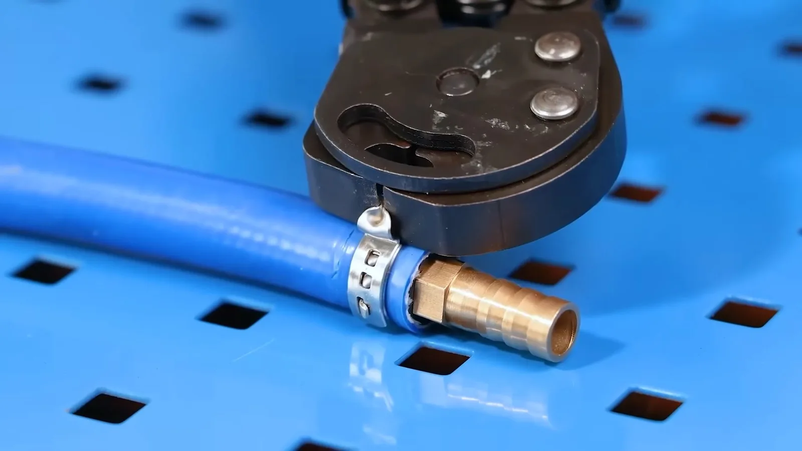 Blue pipe cutter and short metal pipe, seen during repiping service in Chino Valley, AZ.