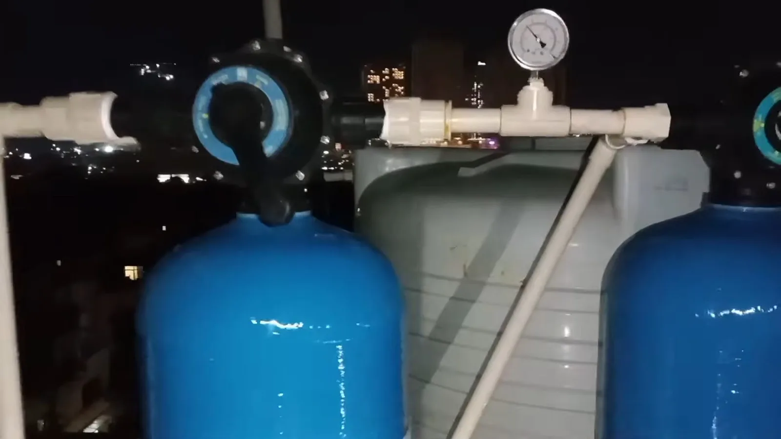 Blue water softener tanks with pressure gauge, photographed during water softener work in Chino Valley, AZ.