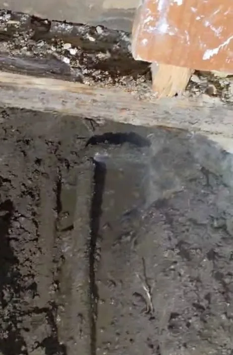 Closeup of concrete slab repair hole, seen during slab leak service in Chino Valley, AZ.