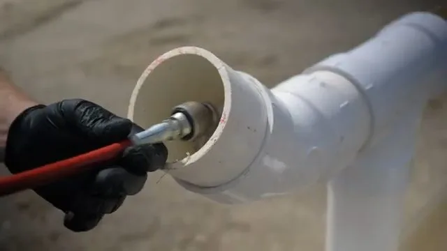 Connecting hydro jet nozzle to hose, captured on a hydro jetting job near Chino Valley, AZ.