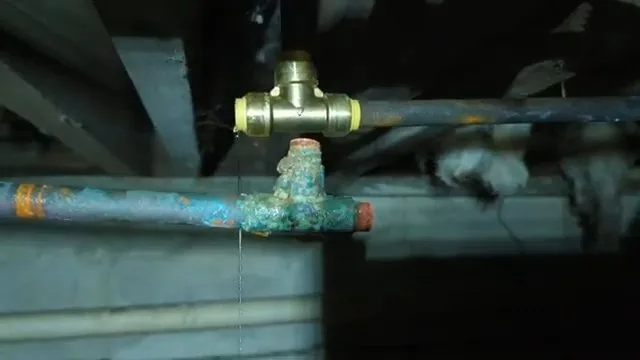 Cutting frozen copper pipe near foundation, photographed during frozen pipe work in Chino Valley, AZ.