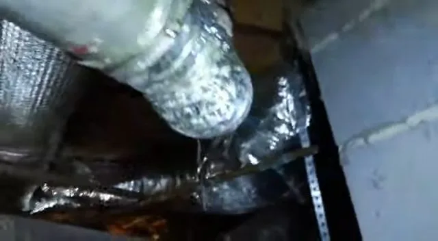 Damaged crawlspace metal pipe close up, seen during crawlspace plumbing service in Paulden, AZ.