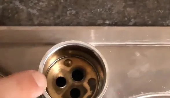 Exposing kitchen faucet cartridge stem, during faucet repair work for a Chino Valley, AZ property.