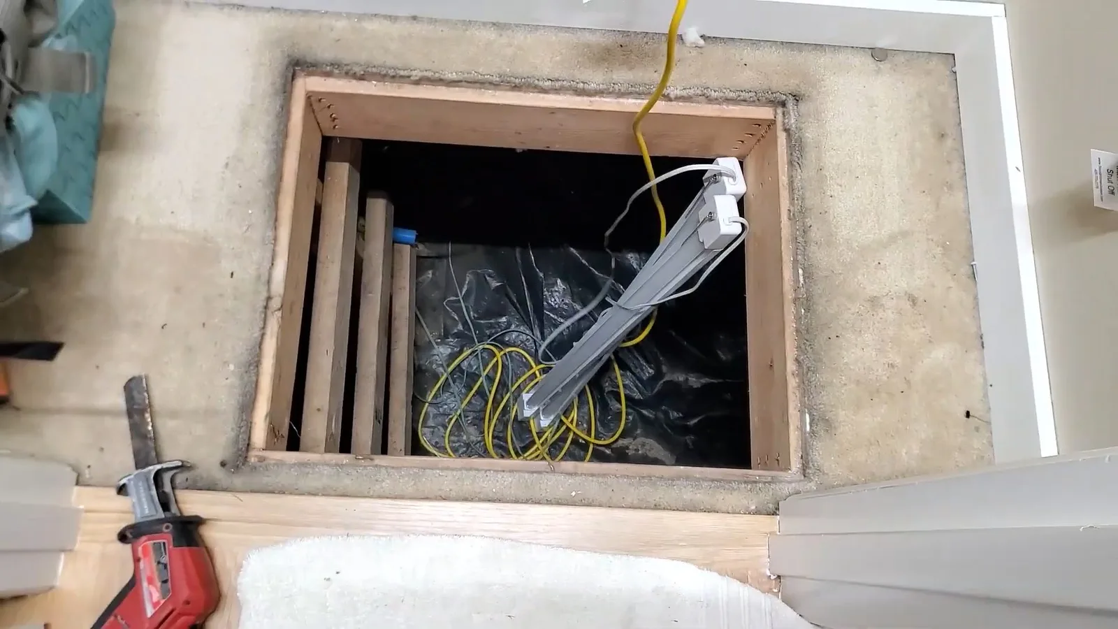 Floor access opening over crawlspace, during a crawlspace plumbing call in Chino Valley, AZ.