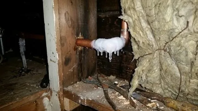 Frozen copper elbow near wall insulation, captured on a frozen pipe job near Chino Valley, AZ.