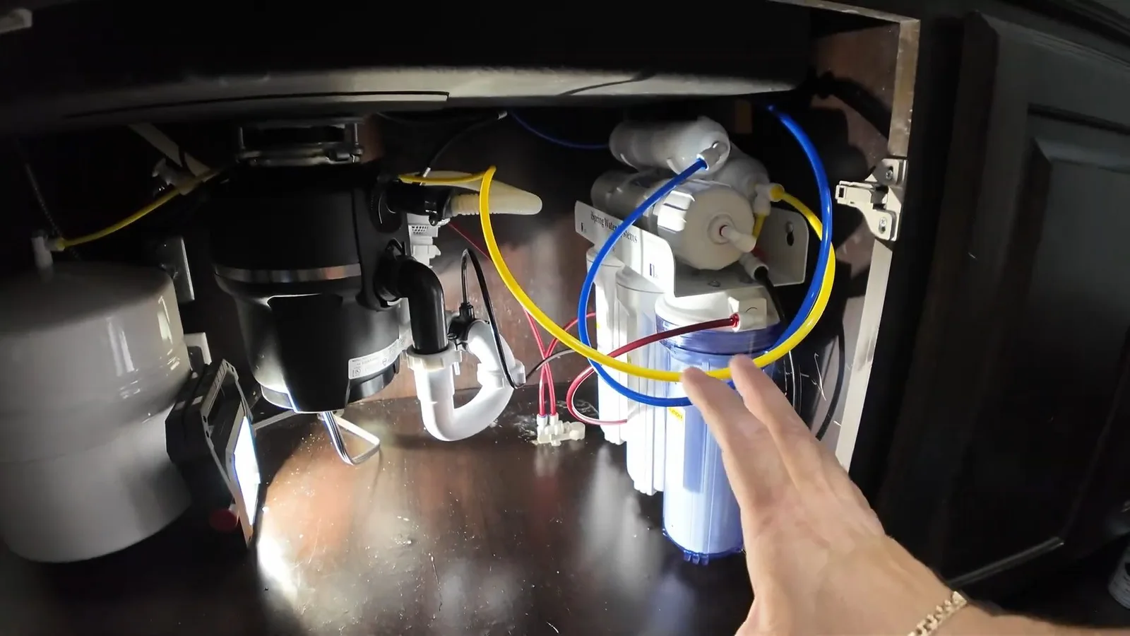Garbage disposal wiring inside sink cabinet, captured on a garbage disposal job near Chino Valley, AZ.