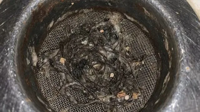 Grease clog inside kitchen drain pipe, photographed during drain cleaning work in Chino Valley, AZ.