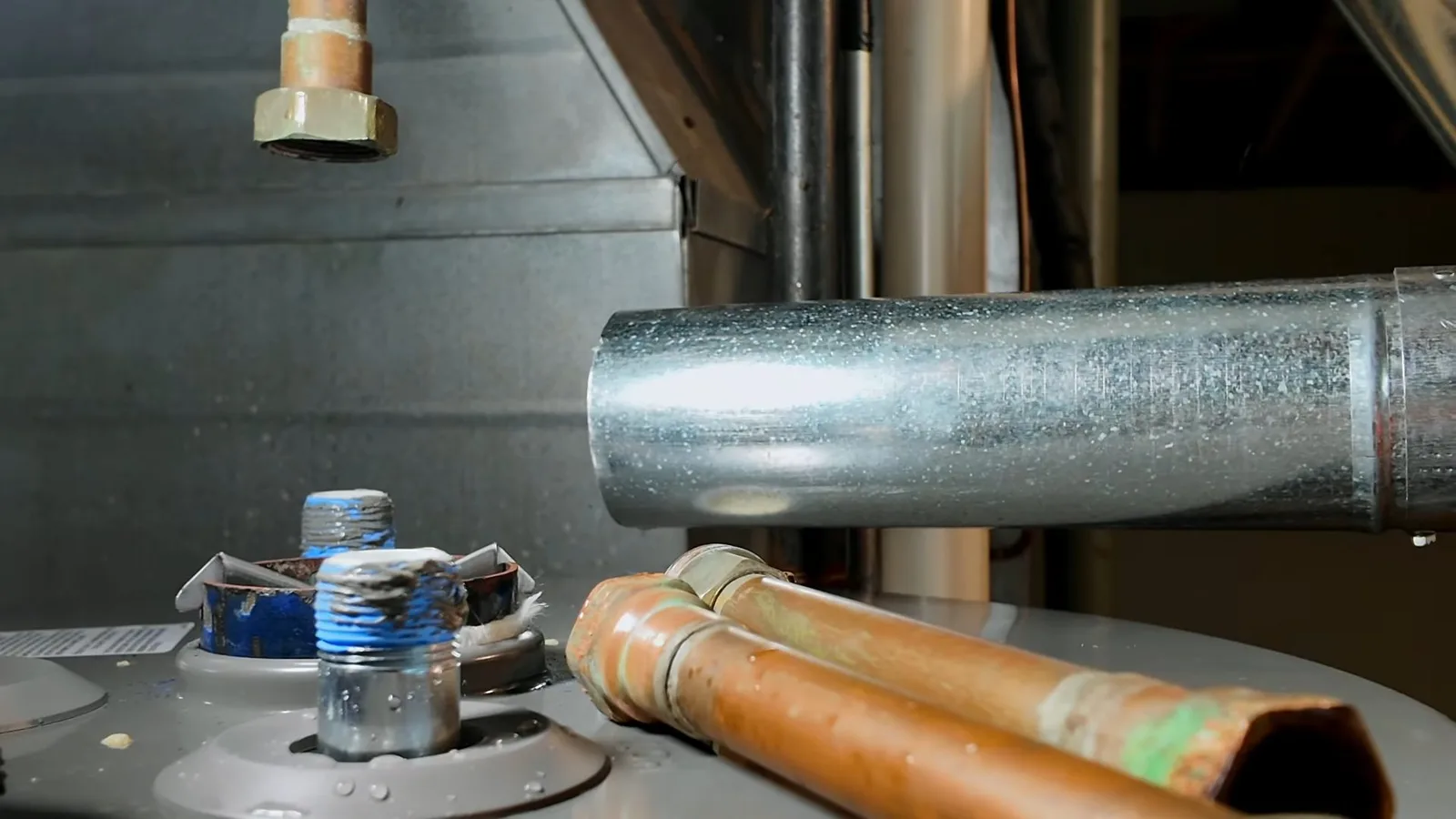 Hot water supply pipes over heater, during hydronic heating work for a Chino Valley, AZ property.