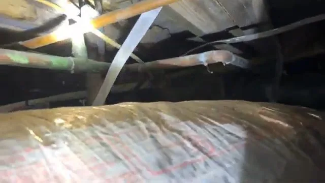 Insulation and damaged wood in crawlspace, captured on a water damage restoration job near Chino Valley, AZ.