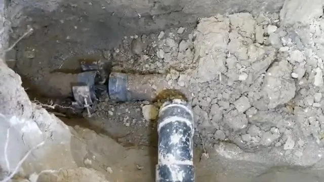 Joining trenchless sewer pipe at excavation, photographed during sewer line work in Chino Valley, AZ.