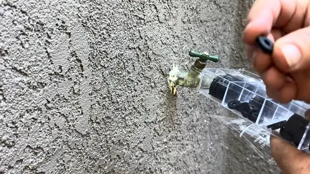 Leaking exterior hose bib on stucco wall, during outdoor faucet repair work for a Chino Valley, AZ property.
