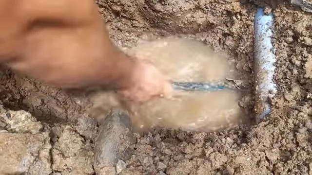Muddy ground around burst water line, during a burst pipe call in Chino Valley, AZ.