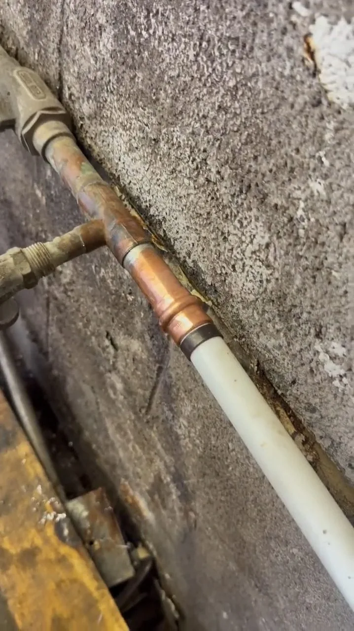 New copper pipe in open concrete floor, photographed during repiping work in Chino Valley, AZ.