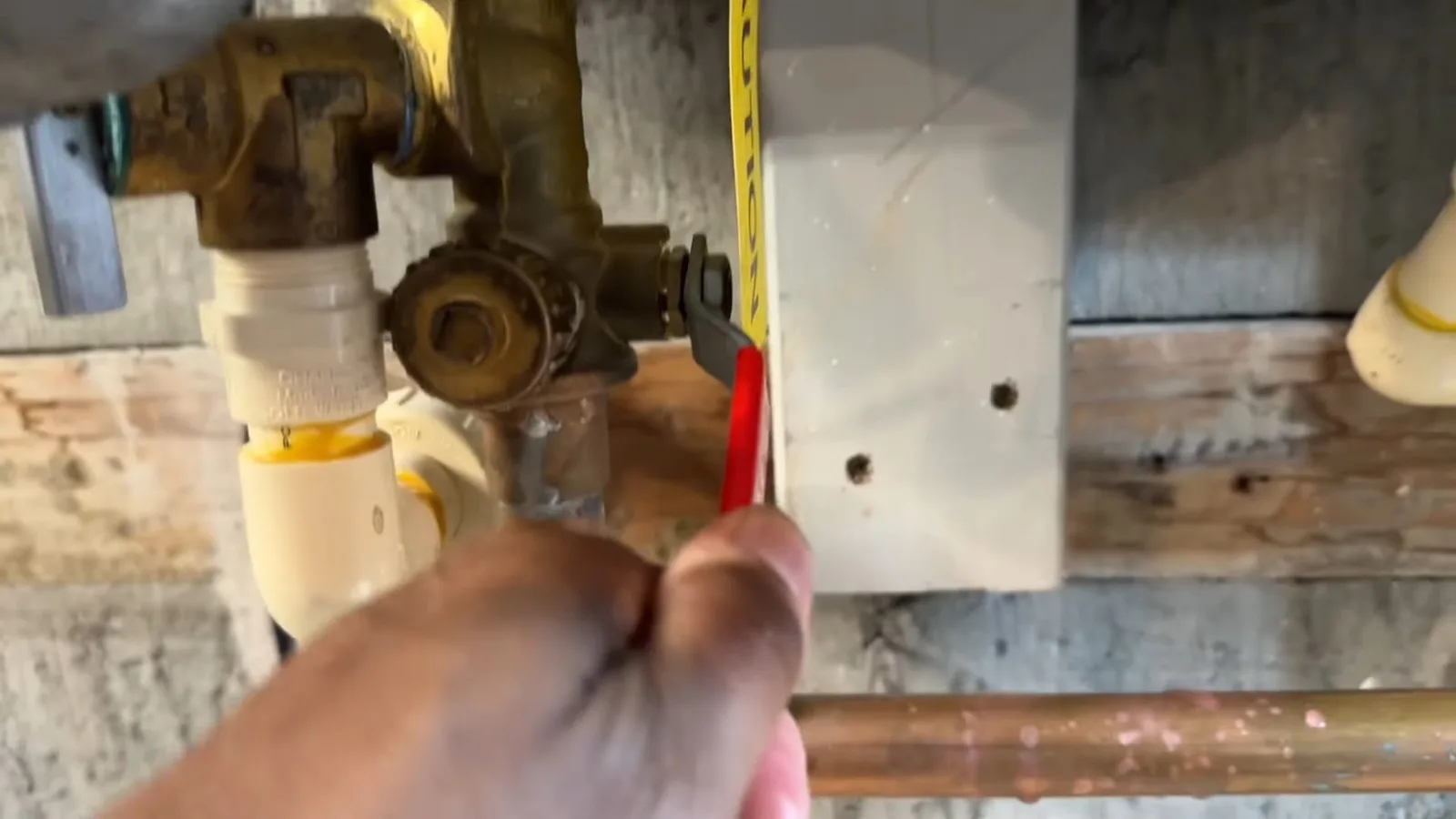Opening tankless water heater service valve, during a frozen pipe call in Chino Valley, AZ.