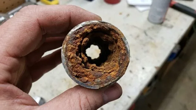 Plunging clogged toilet bowl, during a drain cleaning call in Chino Valley, AZ.