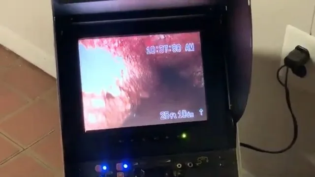 Pointing out blockage on sewer camera monitor, during a sewer camera inspection call in Chino Valley, AZ.