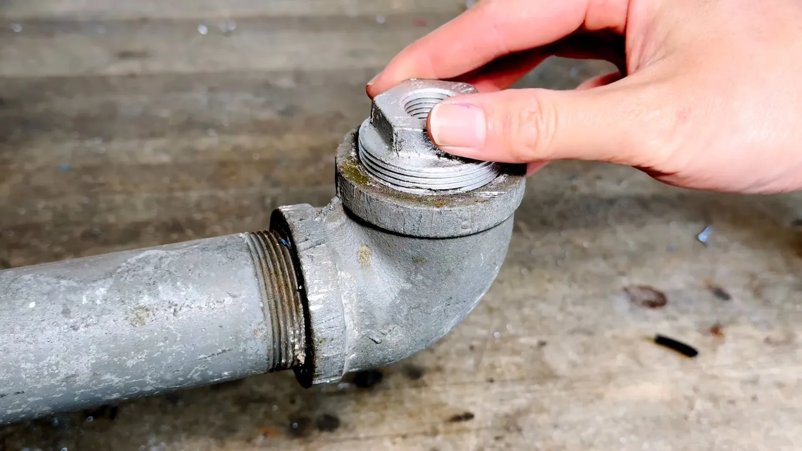 Removing stuck cast iron cleanout cap, captured on a sewer repair job near Chino Valley, AZ.