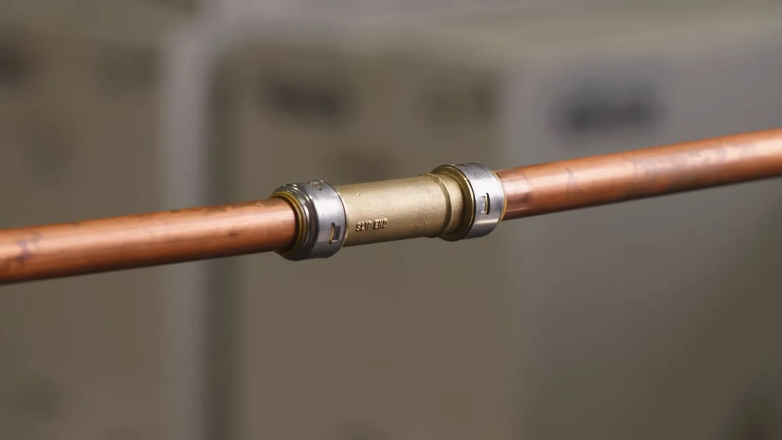 Repaired copper pipe with metal coupling, during a repiping call in Chino Valley, AZ.