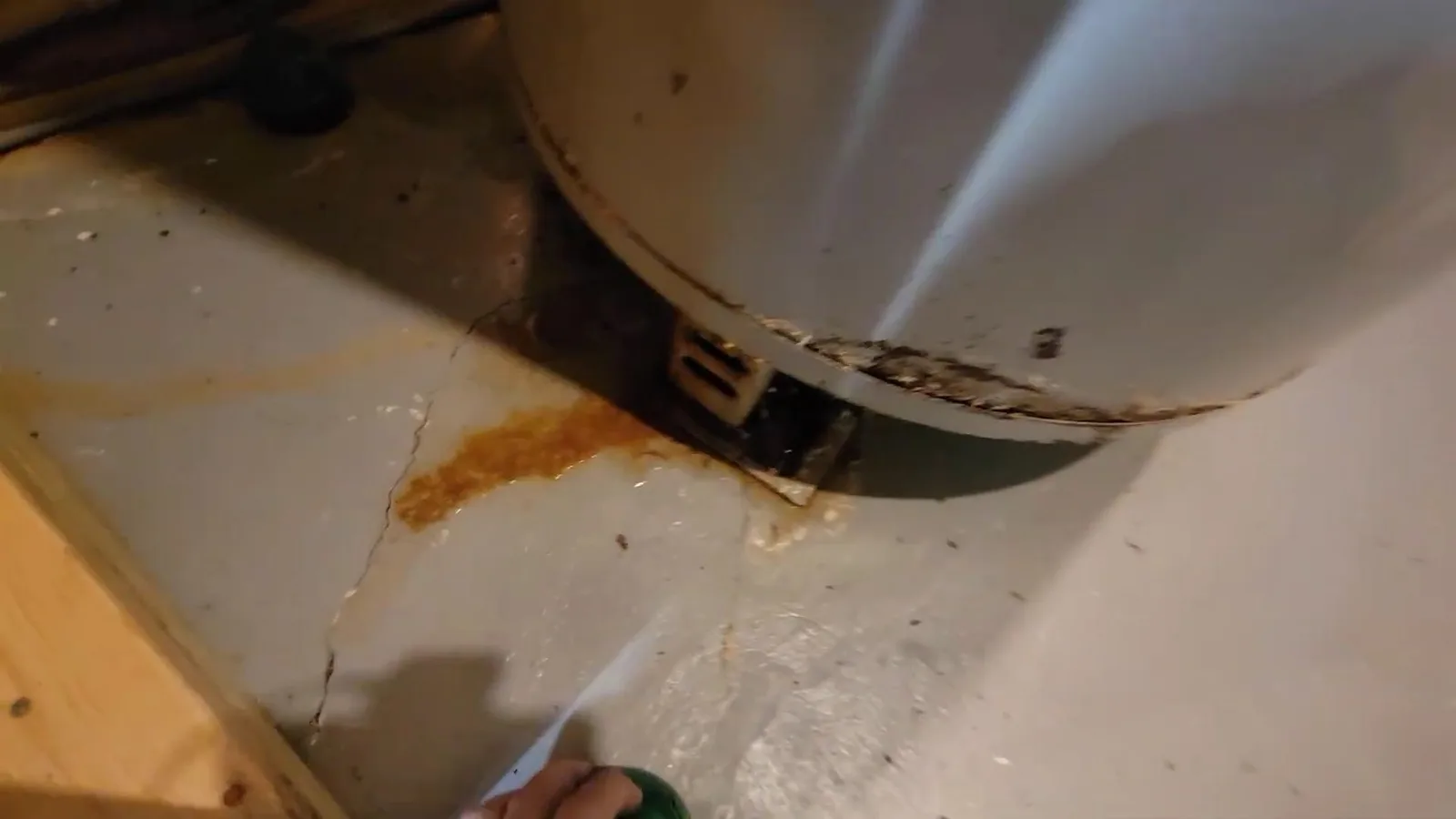 Rust stain below old water heater, during a water heater call in Chino Valley, AZ.