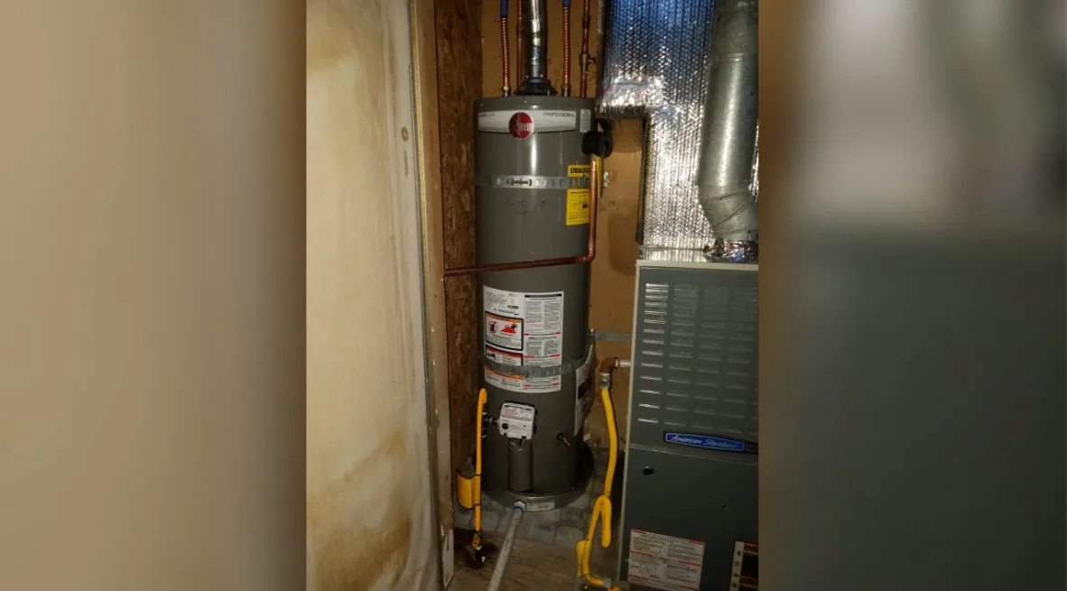 Water heater in cupboard, captured on a water heater job near Chino Valley, AZ.