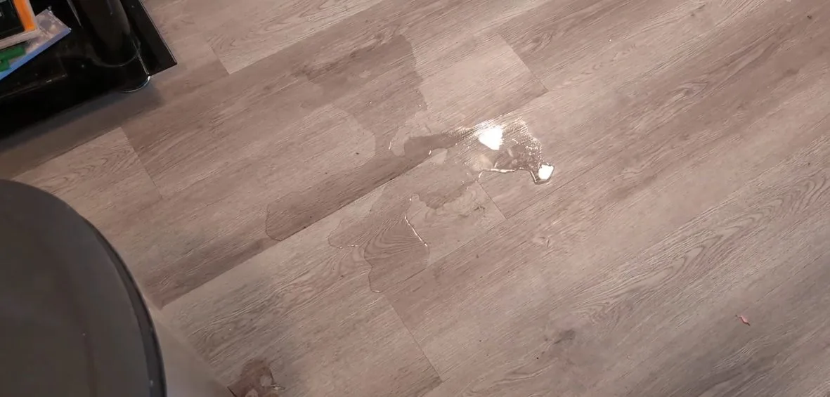 Wet tile floor from slab water leak, during a slab leak call in Chino Valley, AZ.