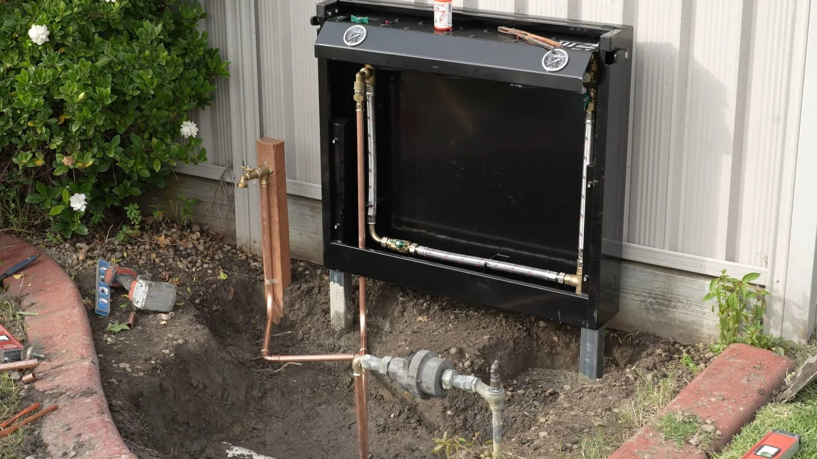 Whole house filter installed on outside wall, captured on a water filtration job near Chino Valley, AZ.